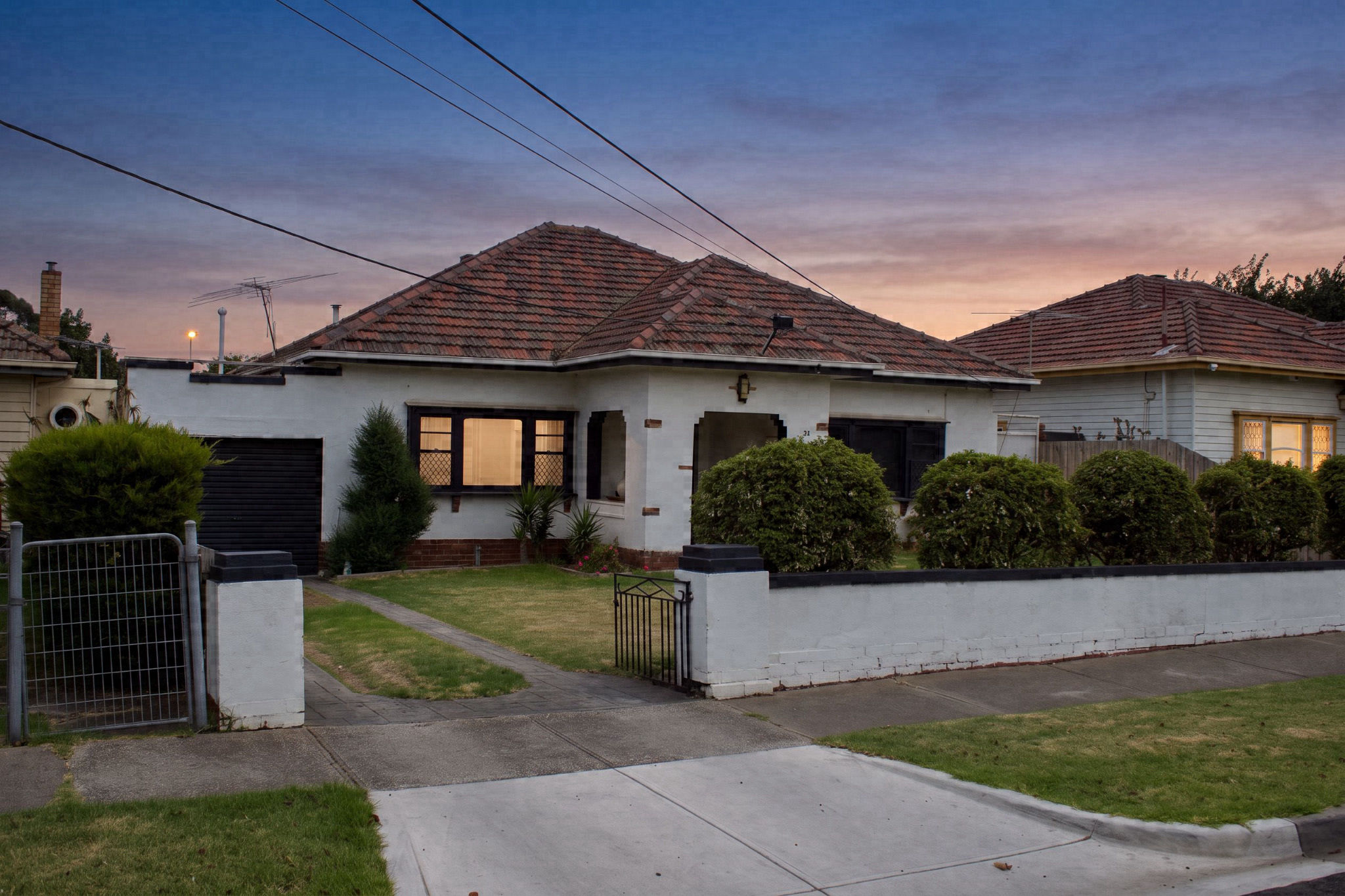 The same exterior relit to dusk